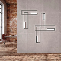 5 appliques de la série Boutique de Mantra sur le mur d'un salon | Aiure