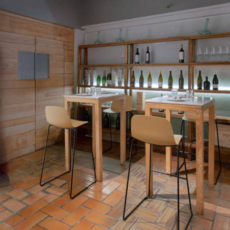 Maarten outdoor stool with skid base by Viccarbe in a covered terrace| Aiure