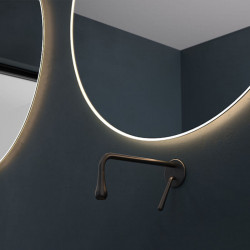 Round LED wall mirror Caledonia by Eurobath in a bathroom close up | Aiure