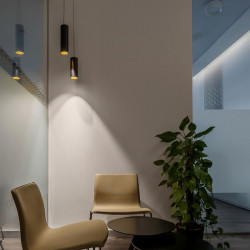 Scope 21 by Arkoslight illuminating on tabletop | AiureDeco