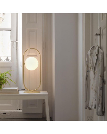 Table lamp with round lampshade Abbacus in a room | Aiure